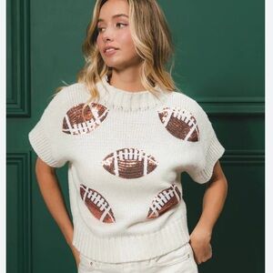 NWT White Short Sleeve Sweater with Sequin Football Design. Size M.